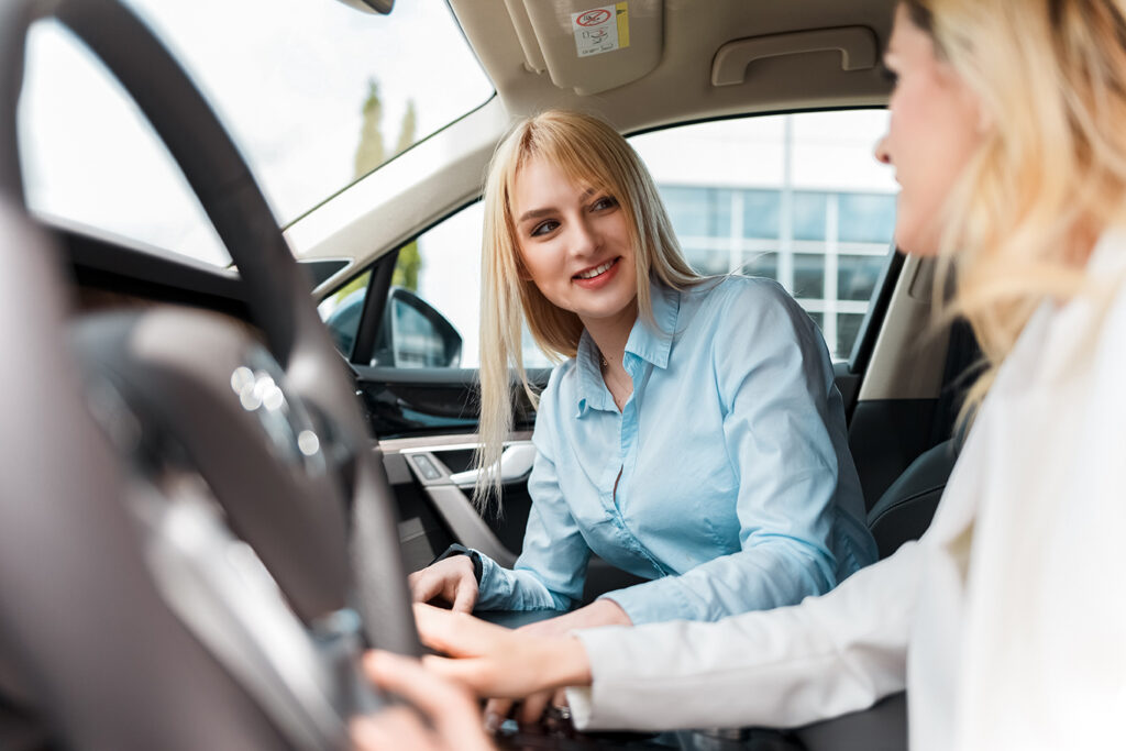 A photo of a student driver: "Teenage driver taking behind-the-wheel lessons"